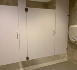 View,of,floating,bathroom,stall,in,public,restrooms.,ceiling,suspended