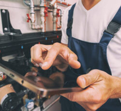 The,technician,checking,the,heating,system,in,the,boiler,room